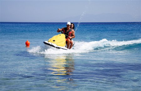 simsearch:644-01437823,k - Young couple on jetski Foto de stock - Royalty Free Premium, Número: 644-01437645