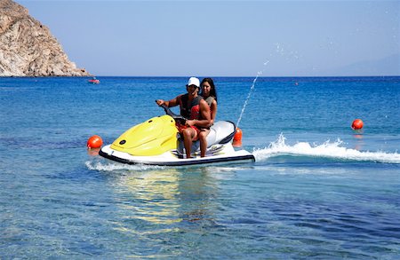 Young couple on jetski Stock Photo - Premium Royalty-Free, Code: 644-01437643