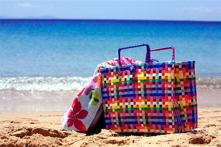 Beach bag with towel on beach Stock Photo - Premium Royalty-Free, Code: 644-01437708
