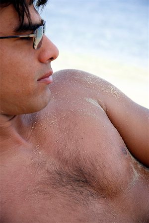 Closeup of young man on beach Stock Photo - Premium Royalty-Free, Code: 644-01437902