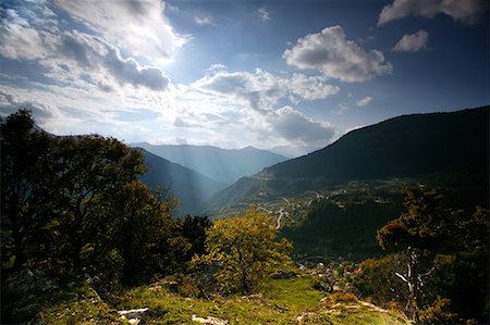 Countryside view with sunlight through clouds Stock Photo - Premium Royalty-Free, Code: 644-01630782