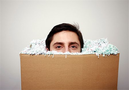 Office worker with head in a box Stock Photo - Premium Royalty-Free, Code: 644-01630957
