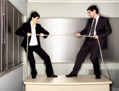 pull funny - Male and female business people pulling ends of rope Stock Photo - Premium Royalty-Free, Code: 644-01630951