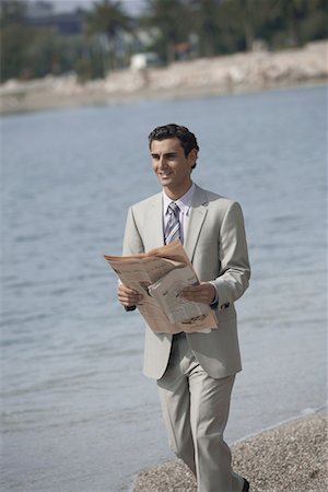 simsearch:644-01825796,k - Businessman on beach with a newspaper Stock Photo - Premium Royalty-Free, Code: 644-01631076