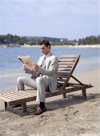 simsearch:644-01825796,k - Businessman on beach with a newspaper Stock Photo - Premium Royalty-Free, Code: 644-01631127