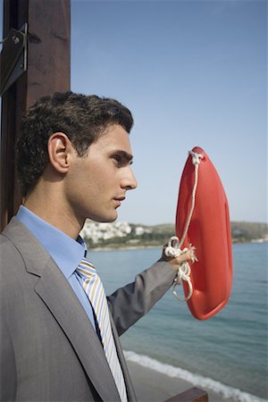 simsearch:644-01825796,k - Businessman with life preserver Stock Photo - Premium Royalty-Free, Code: 644-01631120