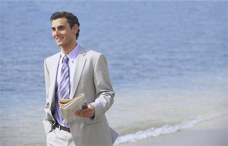 simsearch:644-01825796,k - Businessman on beach holding a newspaper Stock Photo - Premium Royalty-Free, Code: 644-01631154
