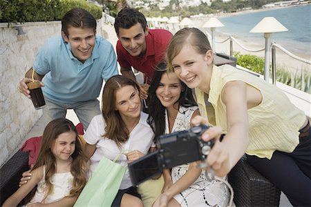 spanish mom daughter beach - Group of friends with shopping bags taking photo Stock Photo - Premium Royalty-Free, Code: 644-01631209