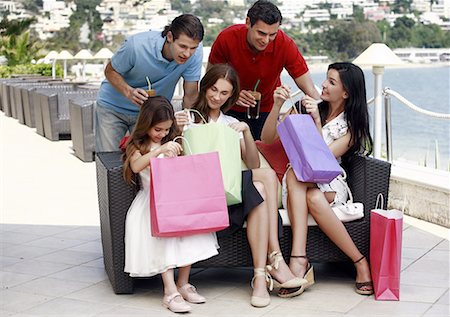 Two couples and child with shopping bags Stock Photo - Premium Royalty-Free, Code: 644-01631270