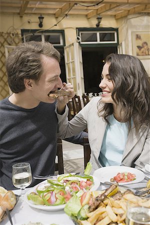 simsearch:644-01631409,k - Woman feeding man a lamb chop Stock Photo - Premium Royalty-Free, Code: 644-01631315