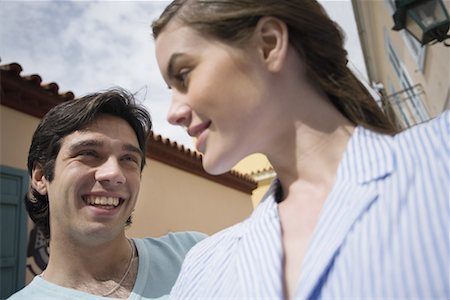 simsearch:644-01631354,k - Man and woman smiling at each other Stock Photo - Premium Royalty-Free, Code: 644-01631342