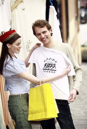 Couple shopping for a Greece tee shirt Stock Photo - Premium Royalty-Free, Code: 644-01631389