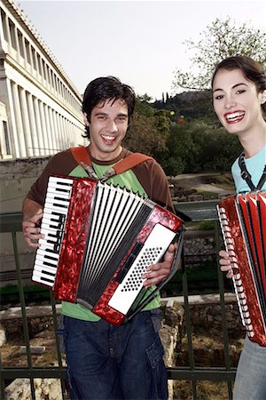 simsearch:644-01631409,k - Couple at archaeological site playing accordion Stock Photo - Premium Royalty-Free, Code: 644-01631412