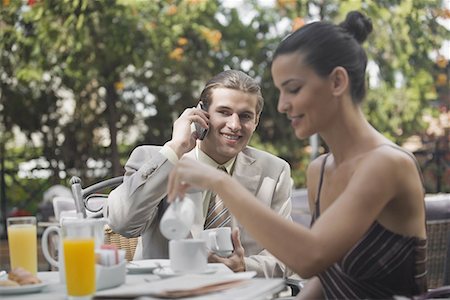 spanish male dress - Business couple in garden cafe Stock Photo - Premium Royalty-Free, Code: 644-01631425