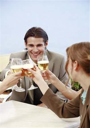 Office workers toasting with beer in outdoor cafe Stock Photo - Premium Royalty-Free, Code: 644-01631512