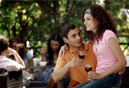 simsearch:644-01631499,k - Woman sitting on man's lap in outdoor cafe Stock Photo - Premium Royalty-Free, Code: 644-01631521