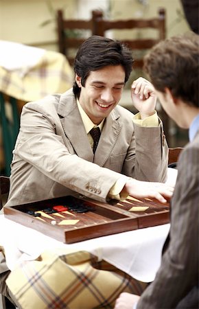 Two businessmen playing backgammon Foto de stock - Sin royalties Premium, Código: 644-01825426