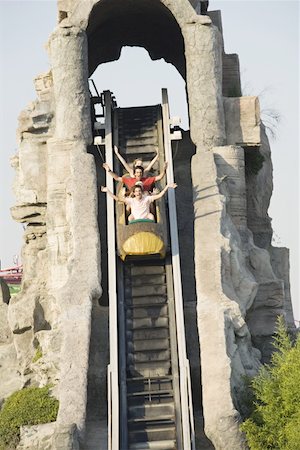 people riding roller coasters - Teenagers on amusement park ride Foto de stock - Sin royalties Premium, Código: 644-01825611