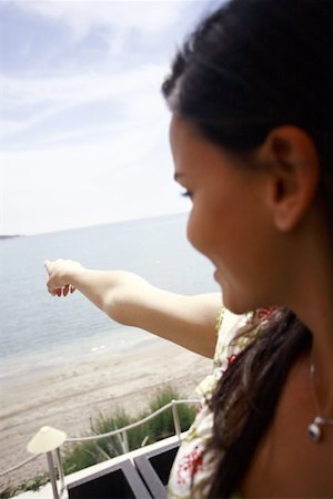 pointing horizon - Woman pointing out to sea Stock Photo - Premium Royalty-Free, Code: 644-01825796