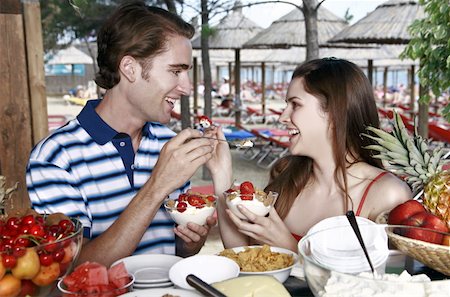 Young adult couple eating breakfast Stock Photo - Premium Royalty-Free, Code: 644-02060544