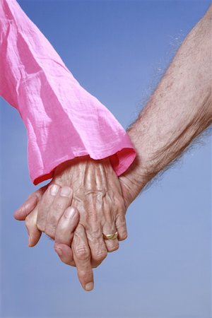 Closeup of senior couple holding hands Foto de stock - Sin royalties Premium, Código: 644-02060633