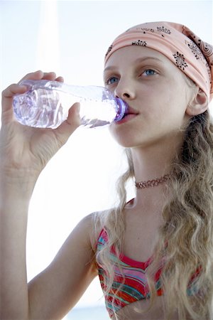 Girl drinking water from a bottle Stock Photo - Premium Royalty-Free, Code: 644-02060646