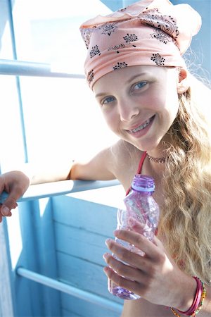 Girl on the beach with water bottle Stock Photo - Premium Royalty-Free, Code: 644-02060642