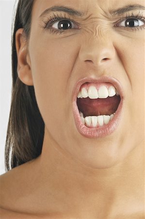 pictures of angry women mouths - Female young adult face;shouting Stock Photo - Premium Royalty-Free, Code: 644-02152742