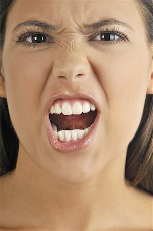 pictures of angry women mouths - Female young adult face;shouting Stock Photo - Premium Royalty-Free, Code: 644-02152743