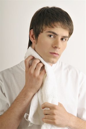 simsearch:644-02152773,k - Young male adult drying chin with towel Stock Photo - Premium Royalty-Free, Code: 644-02152794