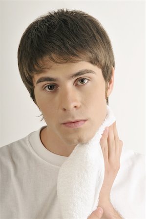 simsearch:644-02152773,k - Young male adult drying chin with towel Stock Photo - Premium Royalty-Free, Code: 644-02152791