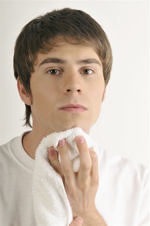 simsearch:644-02152773,k - Young male adult drying chin with towel Stock Photo - Premium Royalty-Free, Code: 644-02152792