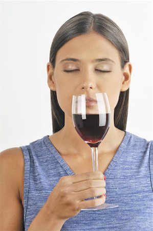 simsearch:644-02153100,k - Female young adult smelling a glass of red wine Stock Photo - Premium Royalty-Free, Code: 644-02152877