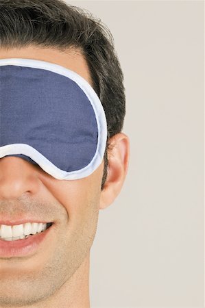 Young male adult with night shade over eyes Stock Photo - Premium Royalty-Free, Code: 644-02152969