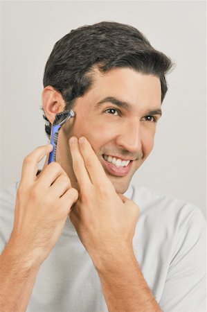 simsearch:644-02152773,k - Young male adult shaving face with razor Stock Photo - Premium Royalty-Free, Code: 644-02152975