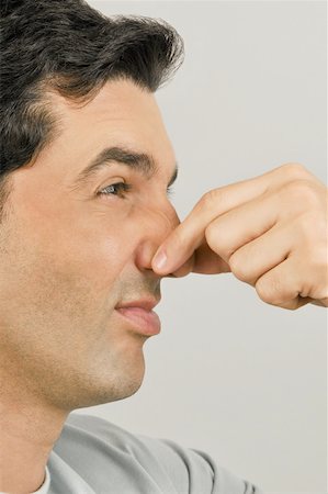 Young male adult holding nose Foto de stock - Sin royalties Premium, Código: 644-02152979