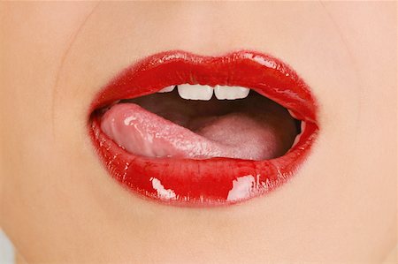 Female young adult mouth;tongue licking lips Stock Photo - Premium Royalty-Free, Code: 644-02153053