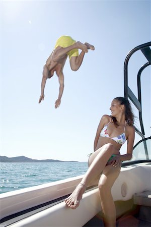 simsearch:644-01825796,k - Couple on boat;male diving Stock Photo - Premium Royalty-Free, Code: 644-02153199