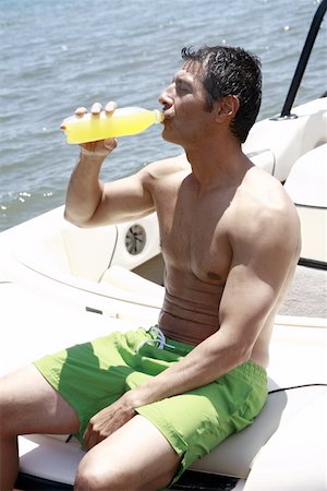 simsearch:644-01825796,k - Male adult on boat drinking juice Stock Photo - Premium Royalty-Free, Code: 644-02153236