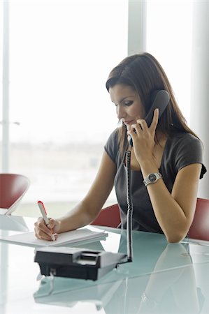 secretary and her telephone - Professional woman on telephone Stock Photo - Premium Royalty-Free, Code: 644-02922938