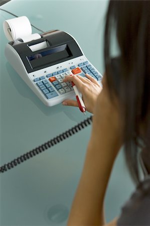 Professional woman on telephone using calculator Foto de stock - Sin royalties Premium, Código: 644-02922940