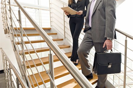 Business people on office staircase Stock Photo - Premium Royalty-Free, Code: 644-02923115