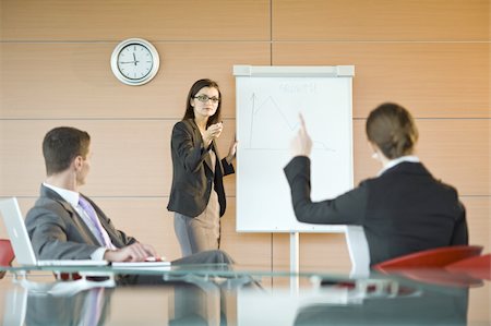 Businesswoman giving a presentation Stock Photo - Premium Royalty-Free, Code: 644-02923146