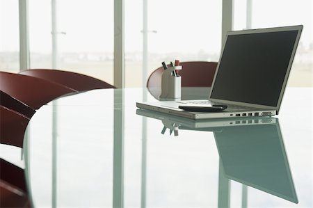 financial technology corporate - Laptop with cell phone on conference table Stock Photo - Premium Royalty-Free, Code: 644-02923177