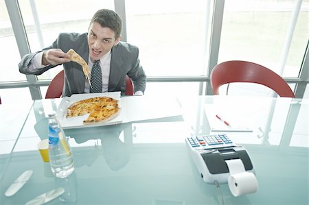 simsearch:644-02923242,k - Businessman eating pizza at desk Stock Photo - Premium Royalty-Free, Code: 644-02923237