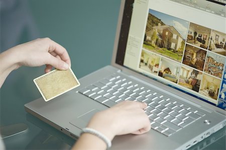 spanish mediterranean houses interiors - Businesswoman's hands holding credit card at laptop Stock Photo - Premium Royalty-Free, Code: 644-02923298