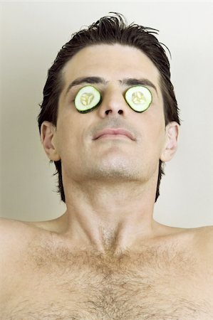 salon and spa - Young man with cucumber slices on his eyes Stock Photo - Premium Royalty-Free, Code: 644-02923397