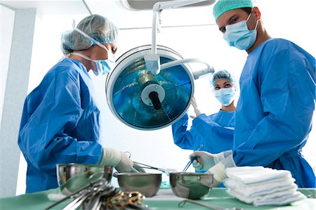 protective clothing nurse - Medical personnel in operating room Stock Photo - Premium Royalty-Free, Code: 644-03659456