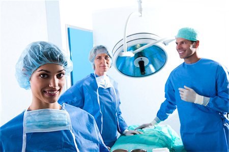 Medical personnel in operating room Stock Photo - Premium Royalty-Free, Code: 644-03659487