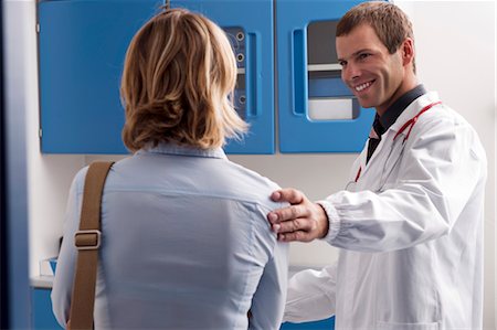 female doctor with male patient - Patient visiting doctor Stock Photo - Premium Royalty-Free, Code: 644-03659519